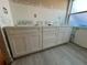 New white bathroom vanity cabinets installed, ready for finishing touches at 6228 Lonnie Lee Ln, Hudson, FL 34667