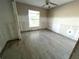 Cozy bedroom featuring tile floors, a window for natural light, and ample space at 6228 Lonnie Lee Ln, Hudson, FL 34667