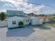 Two-story waterfront home featuring a well-kept yard and a two car garage at 6228 Lonnie Lee Ln, Hudson, FL 34667