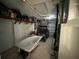 Garage with lots of storage and golf cart at 6228 Lonnie Lee Ln, Hudson, FL 34667
