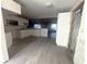 Open kitchen with white cabinets, tile floors, and modern design for a bright and airy feel at 6228 Lonnie Lee Ln, Hudson, FL 34667
