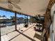 Relaxing screened porch with water view and ceiling fans - perfect for enjoying the outdoors at 6228 Lonnie Lee Ln, Hudson, FL 34667