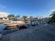 Scenic waterfront view featuring private boat dock, boat, and serene canal in residential neighborhood at 6228 Lonnie Lee Ln, Hudson, FL 34667