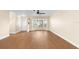 Living room features wood floors, neutral paint, a bay window, ceiling fan, and a built-in niche at 6387 Plantation Rd, Spring Hill, FL 34606