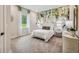 Bright bedroom with leaf-patterned wallpaper, carpet, and neutral decor at 6470 Summit View Dr, Brooksville, FL 34601