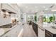 Modern kitchen with a large kitchen island, new appliances, and an open floor plan at 6470 Summit View Dr, Brooksville, FL 34601