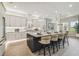 Stylish kitchen featuring a large island with seating, modern appliances, and ample cabinet space at 6470 Summit View Dr, Brooksville, FL 34601