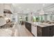 Open concept kitchen with stainless steel appliances and large center island and eat-in dining at 6470 Summit View Dr, Brooksville, FL 34601