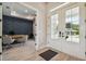 Inviting office featuring a decorative accent wall, a modern desk, and double glass pane doors at 6470 Summit View Dr, Brooksville, FL 34601