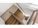 View looking down carpeted staircase with light tile landing at 6800 Sunset Way # 1006, St Pete Beach, FL 33706