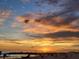 A picturesque sunset over the ocean, casting warm hues across the sky and tranquil beach at 6800 Sunset Way # 1006, St Pete Beach, FL 33706