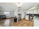 Open-concept kitchen features stainless steel appliances and warm-toned tile flooring at 7427 Congress St, New Port Richey, FL 34653