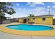 Backyard oasis with a sparkling in-ground pool and a private fenced yard at 7427 Congress St, New Port Richey, FL 34653