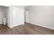 Bright bedroom featuring modern floors, neutral walls, and closet with doors at 8338 Maybelle Dr, Weeki Wachee, FL 34613