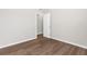 Empty bedroom featuring wood floors and a neutral paint color at 8338 Maybelle Dr, Weeki Wachee, FL 34613