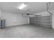 Spacious two car garage with overhead lighting and garage door opener at 8338 Maybelle Dr, Weeki Wachee, FL 34613