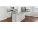 Bright kitchen featuring granite countertops, stainless steel appliances, and an island at 8338 Maybelle Dr, Weeki Wachee, FL 34613