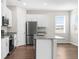 Bright kitchen featuring stainless steel appliances and a central island at 8338 Maybelle Dr, Weeki Wachee, FL 34613