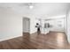 Inviting living space featuring wood-look floors and a seamless flow to the kitchen area at 8338 Maybelle Dr, Weeki Wachee, FL 34613