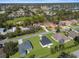 An aerial view of homes and the community, showcasing its serene location and neighborhood layout at 8828 Mississippi Run, Weeki Wachee, FL 34613