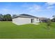 A spacious backyard featuring a well-maintained lawn and a concrete patio, perfect for outdoor entertaining at 8828 Mississippi Run, Weeki Wachee, FL 34613