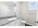 Bathroom with granite countertop vanity and tiled shower/tub at 8828 Mississippi Run, Weeki Wachee, FL 34613