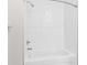 A view of the white subway tiled shower and tub combo at 8828 Mississippi Run, Weeki Wachee, FL 34613