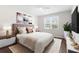 Stylishly furnished bedroom featuring a large window, a plush rug, and modern decor at 8828 Mississippi Run, Weeki Wachee, FL 34613