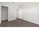 A simple bedroom shows the entry to both a closet and the hallway at 8828 Mississippi Run, Weeki Wachee, FL 34613