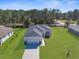 Well-maintained single-story home featuring an attached two-car garage and a spacious front lawn at 8828 Mississippi Run, Weeki Wachee, FL 34613