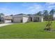 Charming single-story home with a well-maintained front yard at 8828 Mississippi Run, Weeki Wachee, FL 34613