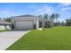Charming single Gathering home featuring a two car garage, new landscaping and a well manicured lawn at 8828 Mississippi Run, Weeki Wachee, FL 34613