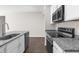 Modern kitchen with stainless steel appliances and granite countertops at 8828 Mississippi Run, Weeki Wachee, FL 34613