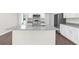Bright kitchen showcases a spacious island with granite countertops and a modern faucet at 8828 Mississippi Run, Weeki Wachee, FL 34613