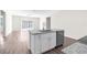 Modern kitchen island with granite countertop and stainless steel dishwasher at 8828 Mississippi Run, Weeki Wachee, FL 34613