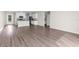 Open-concept living room and kitchen area with stainless appliances at 8828 Mississippi Run, Weeki Wachee, FL 34613