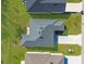 Bird's eye view of a home showing driveway, roof, and lawn at 9062 Wade St, Brooksville, FL 34613