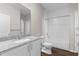 Bathroom featuring granite countertops, white cabinets, and a shower/tub combo with tile surround at 9062 Wade St, Brooksville, FL 34613
