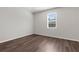 Bedroom featuring wood-look flooring and a window with blinds at 9062 Wade St, Brooksville, FL 34613