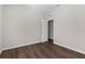 Bedroom featuring wood-look flooring and neutral walls, ready for personalization at 9062 Wade St, Brooksville, FL 34613