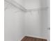 Walk-in closet with sturdy shelving and a view of wood-look flooring at 9062 Wade St, Brooksville, FL 34613