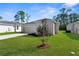 Charming home with a well-kept lawn, mature landscaping, and a two-car garage at 9062 Wade St, Brooksville, FL 34613