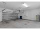 Spacious two-car garage with a rolling door, ample room for parking and storage at 9062 Wade St, Brooksville, FL 34613