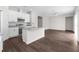 Open-concept kitchen featuring granite countertops, stainless steel appliances, and a breakfast bar at 9062 Wade St, Brooksville, FL 34613