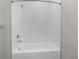 Shower and tub with white subway tile and chrome fixtures at 9062 Wade St, Brooksville, FL 34613