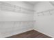 Spacious walk-in closet featuring wire shelving and wood-look flooring at 9062 Wade St, Brooksville, FL 34613