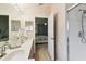 Bathroom featuring double sinks, neutral tones, and a walk-in shower at 9336 Creekside Ct, Hudson, FL 34669