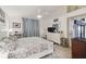 Spacious bedroom featuring a ceiling fan, dresser, and light-filled ambiance at 9336 Creekside Ct, Hudson, FL 34669