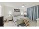 Inviting bedroom with neutral tones, a ceiling fan, and a cozy pet corner at 9336 Creekside Ct, Hudson, FL 34669