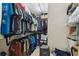 Organized walk-in closet with ample hanging space and shelving for storage solutions at 9336 Creekside Ct, Hudson, FL 34669